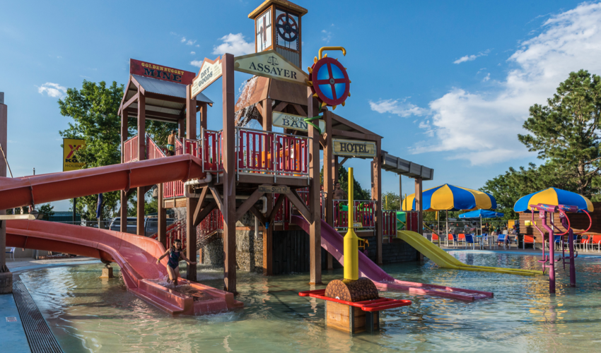 Children playing in a two-story playground in a pool