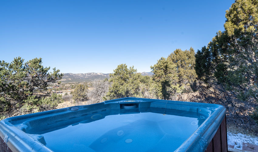 Outdoor hot tub overlooking mountain views