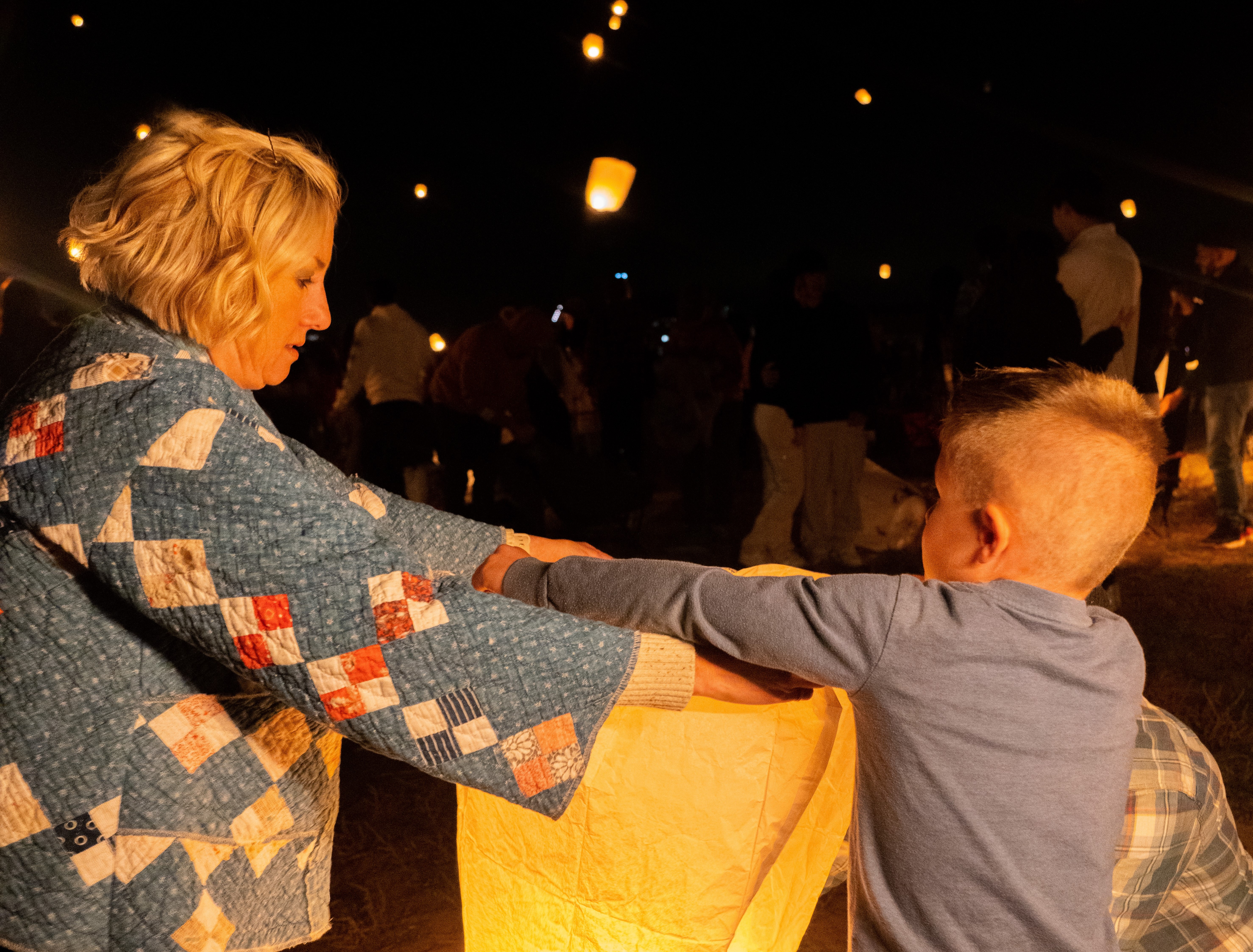 mother and son releasing lantern