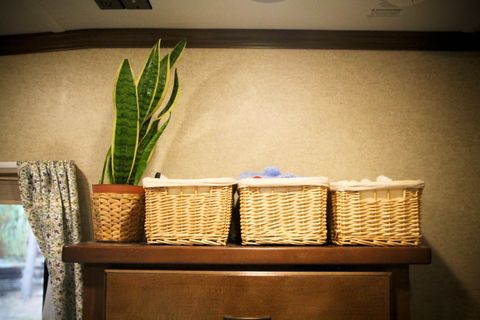 Baskets arranged neatly on a shelf in an RV